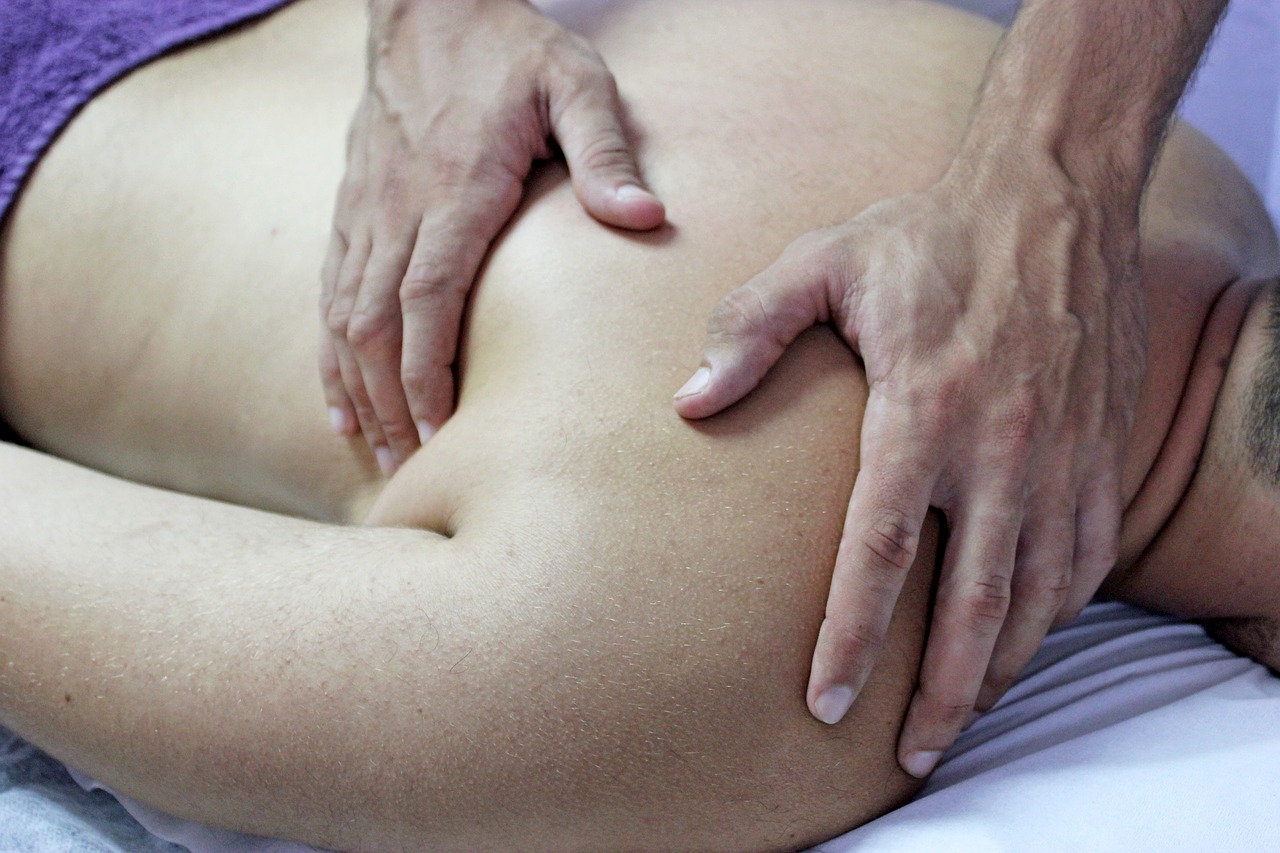 Male Massager Therapist Doing Therapeutic Back Massage Ot Client