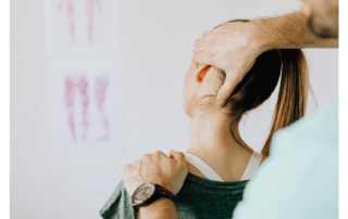 Practitioner gently stretching client neck with muscle energy techniques