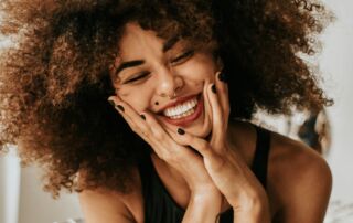 happy woman learns how massage therapy increases immunity markers